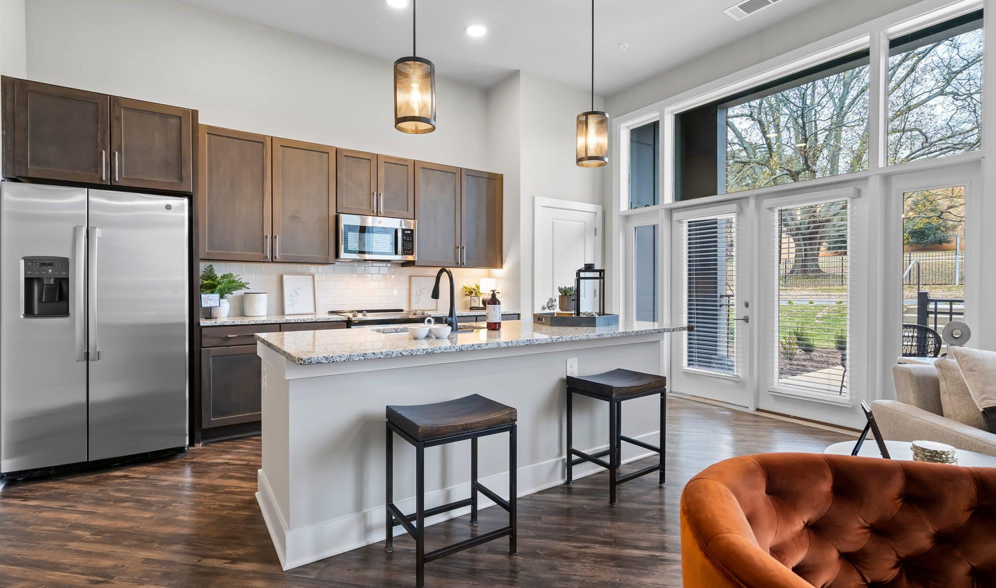 Stainless steel appliances and kitchen island in apartment homes at .408 Jackson